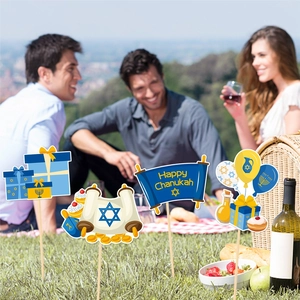 Hanukkah photo booth props with Menorah and Star of David signs for festive party decor