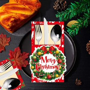 Christmas cutlery holder bag with red wreath design and Merry Christmas greeting