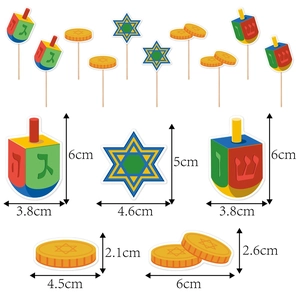 Hanukkah cupcake toppers with colorful dreidels and Star of David design on white background