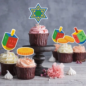 Hanukkah cupcake toppers with Star of David and Dreidel designs on chocolate cakes