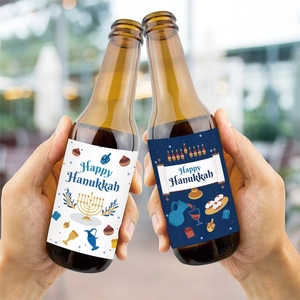Close-up of Happy Hanukkah bottle labels with festive menorah and dreidel icons