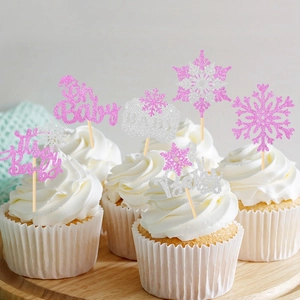 Pink and silver snowflake cake toppers with Oh Baby text for winter baby shower decor