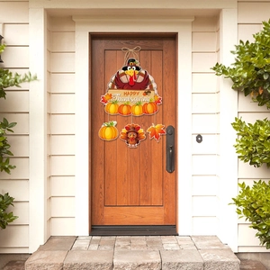 Thanksgiving door hanger with turkey and pumpkin motifs on a wooden entrance background