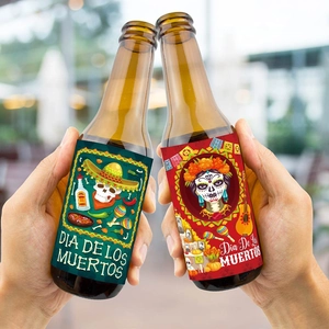 Close-up of Day of the Dead wine bottle labels with vibrant skull designs in a toast
