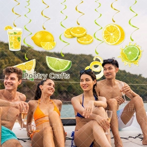 Detailed view of yellow and green lemon party swirls for summer party ceiling decoration