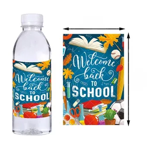 Close-up of school water bottle stickers with colorful academic icons and welcome text
