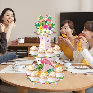 Tropical three-tier cupcake stand with pink flamingo and summer palm leaf decorations