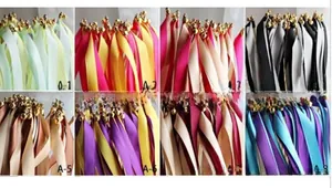Detail view of colorful silk ribbons with golden bells for wedding and party decorations