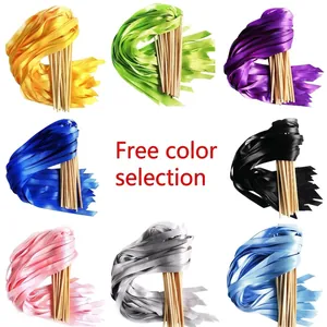 Mix and match colorful wedding ribbon wands with wooden sticks for festive party decorations