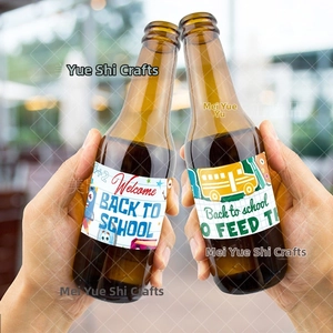 Close-up of hands clinking glass bottles with Back to School party labels and school bus designs