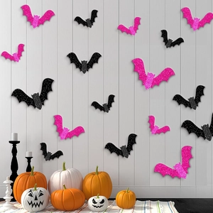 3D Halloween bat wall stickers with black and pink glitter finish on white wood panels