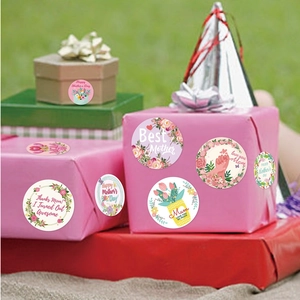 Colorful Mother's Day round gift stickers with floral designs on various gift boxes