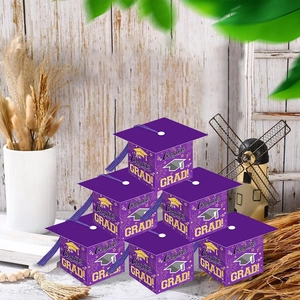 Purple graduation cap gift boxes with tassels and Congrats Grad text in a 6-piece set