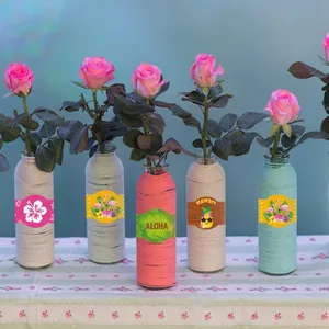 Five Hawaiian-style woven glass vases with tropical stickers and fresh roses