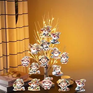 Summer gnome party decorations with beach elements hanging on a decorative branch