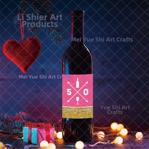 Detail of pink 50th birthday wine bottle label with Cheers to 50 Years gold glitter text
