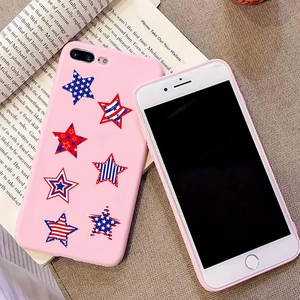 Pink iPhone case with American flag stars on an open book, soft aesthetic photography