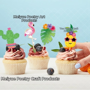 Detail of tropical cake toppers featuring flamingo and pineapple on cupcakes