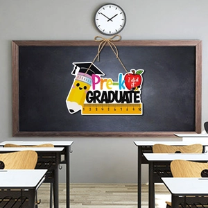Pre-K Graduate door hanger with pencils and graduation cap for preschool party decor