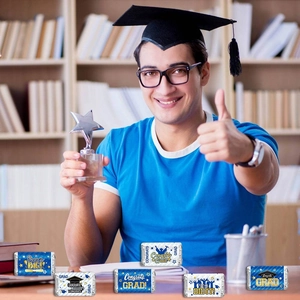 Blue and white graduation candy wrappers with Dream Big and Congrats Grad designs