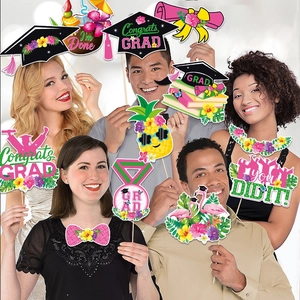 Hawaiian graduation photo booth props with tropical motifs and congratulatory signs