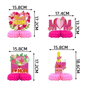 Pink and gold Mother's Day honeycomb centerpieces featuring rose and heart motifs