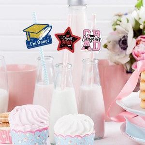 Graduation party straw toppers with glittery grad cap and star designs for festive decor