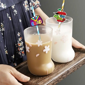 Cat claw glass cup with cherry blossom print, drinking straw and graduation card decor