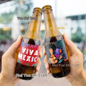 Close-up of Mexican party water bottle labels with Viva Mexico and cactus designs