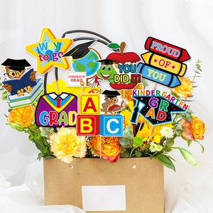 Vibrant kindergarten graduation party vase insert decorations and photo booth props