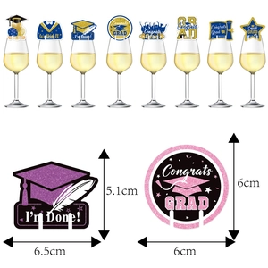 Graduation wine glass markers featuring glitter caps and diplomas for party decor
