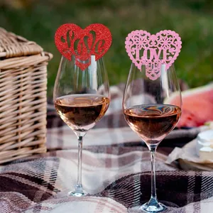 Glittering heart-shaped LOVE wine glass place cards for romantic Valentine party decor