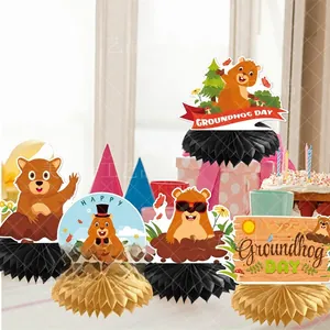 Detailed view of Groundhog Day honeycomb centerpieces with cartoon groundhog cutouts