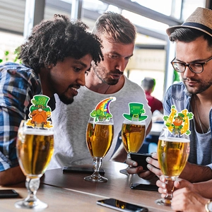 St. Patrick's Day glass toppers with Leprechaun and rainbow motifs on beer glasses