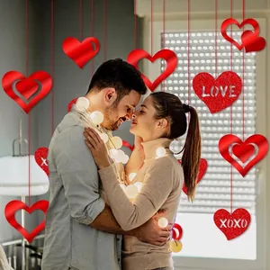 Romantic Valentine heart hanging ornaments with LOVE and XOXO cutouts for party decor