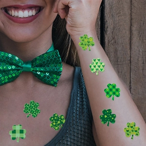Set of St. Patrick's Day shamrock clover stickers with various green patterns for parties