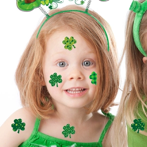 Saint Patrick's Day green clover stickers for face and body decoration on a red hair model