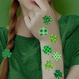 St. Patrick's Day green shamrock temporary stickers shown on arm and hair braid