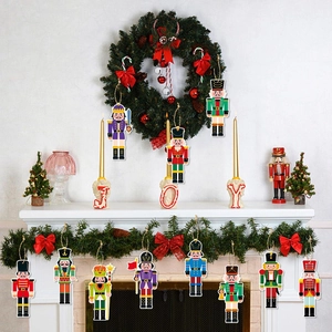 Set of 12 flat wooden Nutcracker ornaments on a festive mantel with warm holiday decor