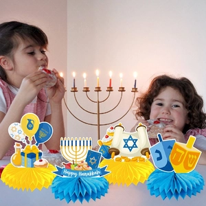 Blue Happy Hanukkah honeycomb centerpieces with Menorah and Dreidel party decorations