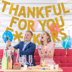Glittery gold Thankful For You banner for Thanksgiving party decoration in festive room