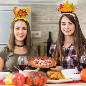 Women wearing festive Thanksgiving headbands with pumpkin and cornucopia designs