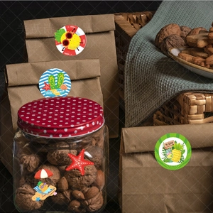 Close-up of Hawaiian summer stickers applied to gift bags and glass bottles