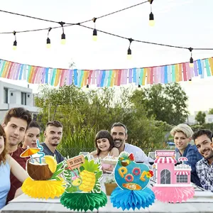 Detail of 4-piece Hawaii summer party honeycomb centerpieces on an outdoor table