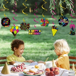 Fluorescent birthday party hanging swirls with Let's Glow Crazy sign for outdoor celebration