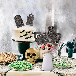 Halloween gravestone cake toppers with skull reliefs and RIP text for party decor