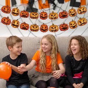 Halloween pumpkin banner decorations with diverse Jack-o'-lantern faces for party decor