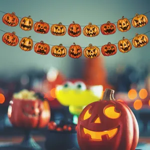Halloween party decoration featuring orange pumpkin banners with classic jack-o-lantern faces
