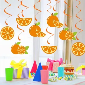 Orange fruit themed birthday party hanging decorations with spirals and citrus cutouts