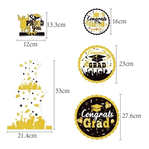 Detail view of black and gold graduation party cake stands with specific size measurements